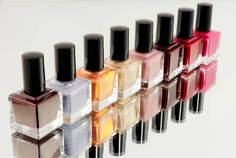 Row of colorful nail polish bottles